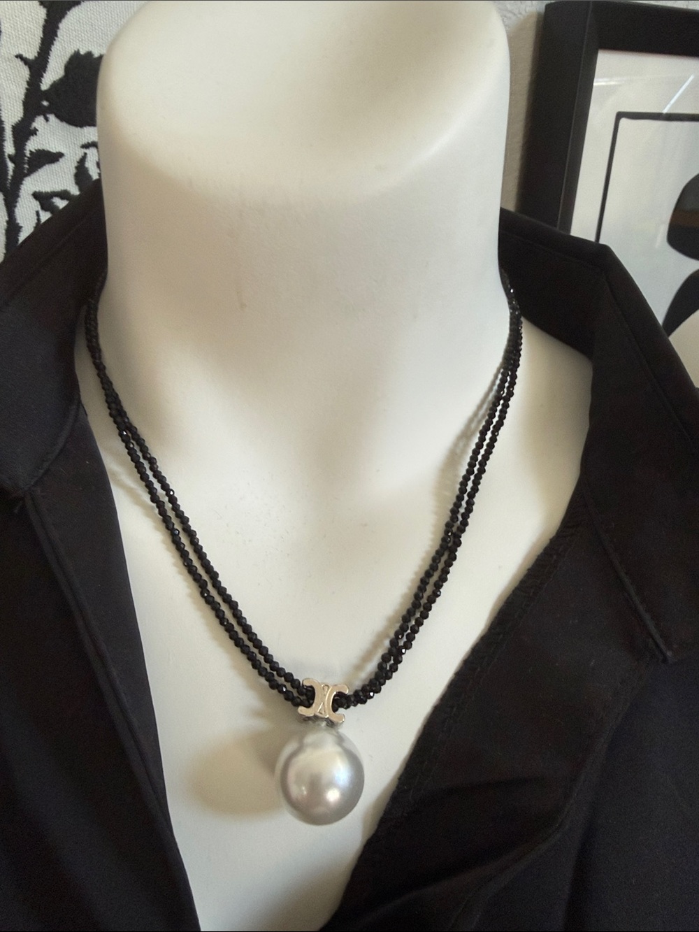 Double-Strand Black Beaded Necklace with Silver Cel logo on Pearl Pendant